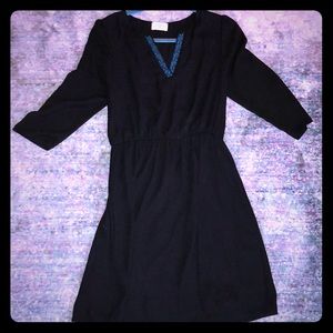 black dress with cinch waist and neck detail
